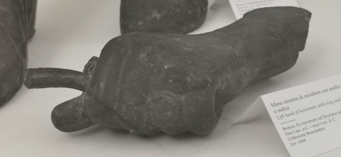 Left hand of male statue with ring and remains of drapery on wrist