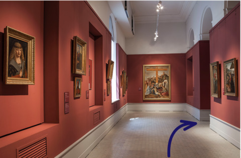 Go to the next section of the exhibition, behind the shield